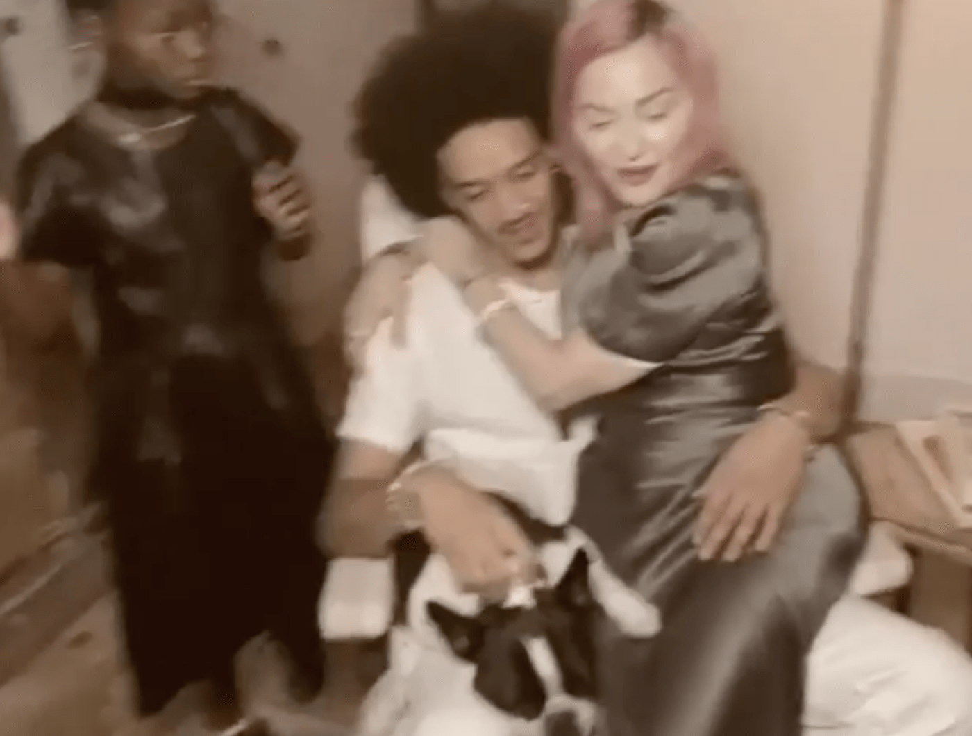 Madonna sitting on boyfriend Ahlamalik Williams' lap 